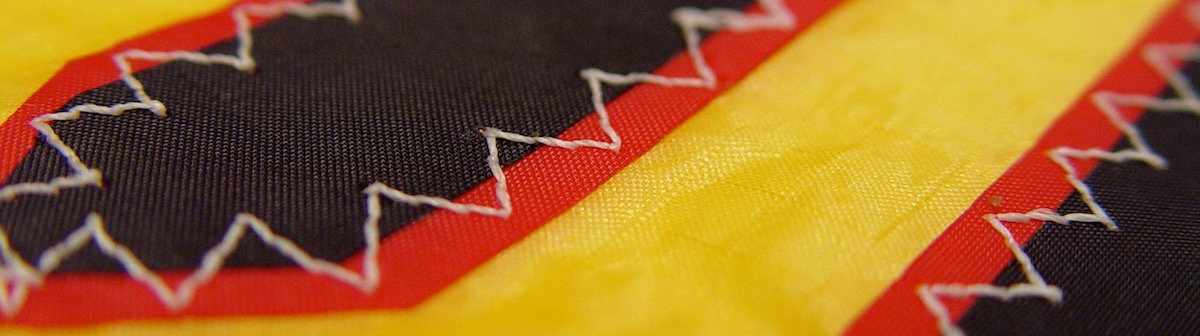 detail of stitching patch on a kite sail