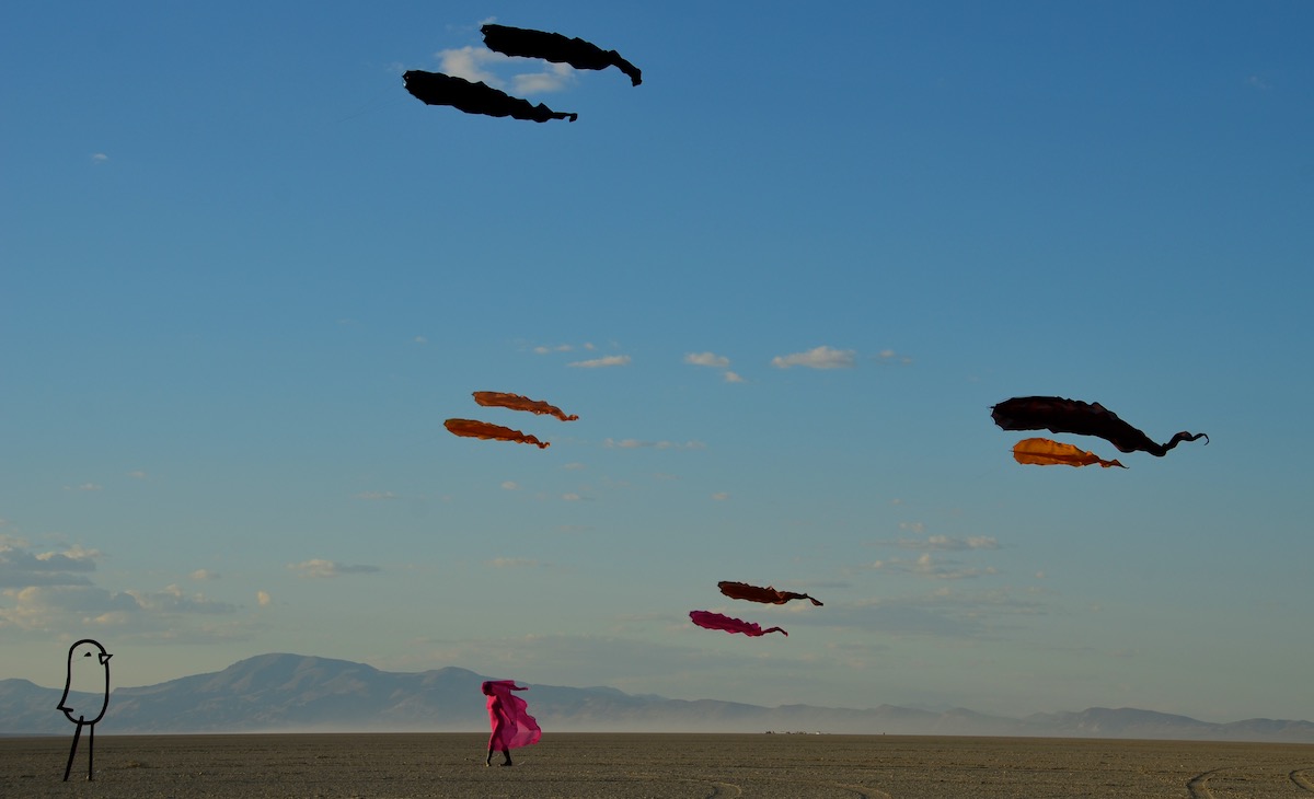 Ruth with flowx in the desert - being watched by Lonely Bird