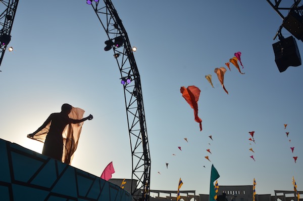 Ruth Whiting on stage in Doha flying show kites